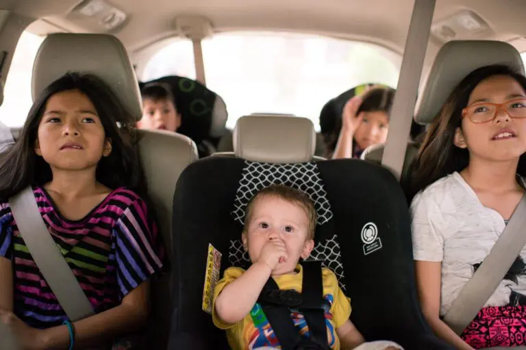 Homeschooling lifestyle Kids in a minivan watching an educational video